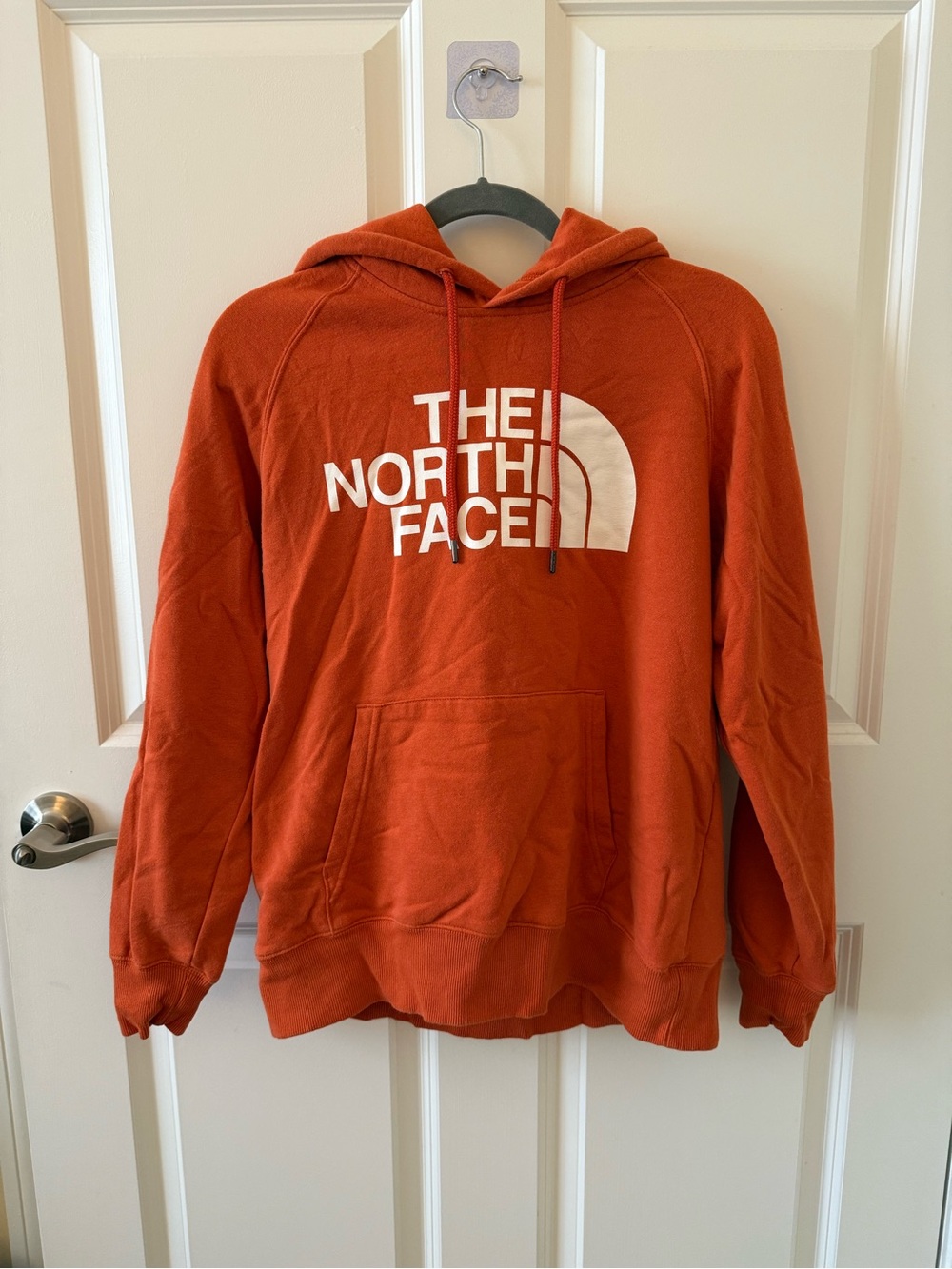 The North Face Women’s Orange Hoodie with White Logo